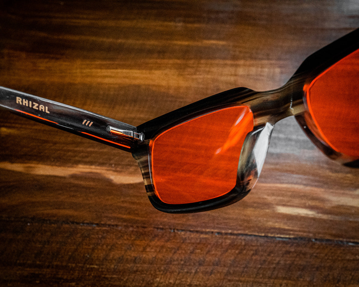 Night blue light blocking glasses with buffalo horn frames, worn on a model